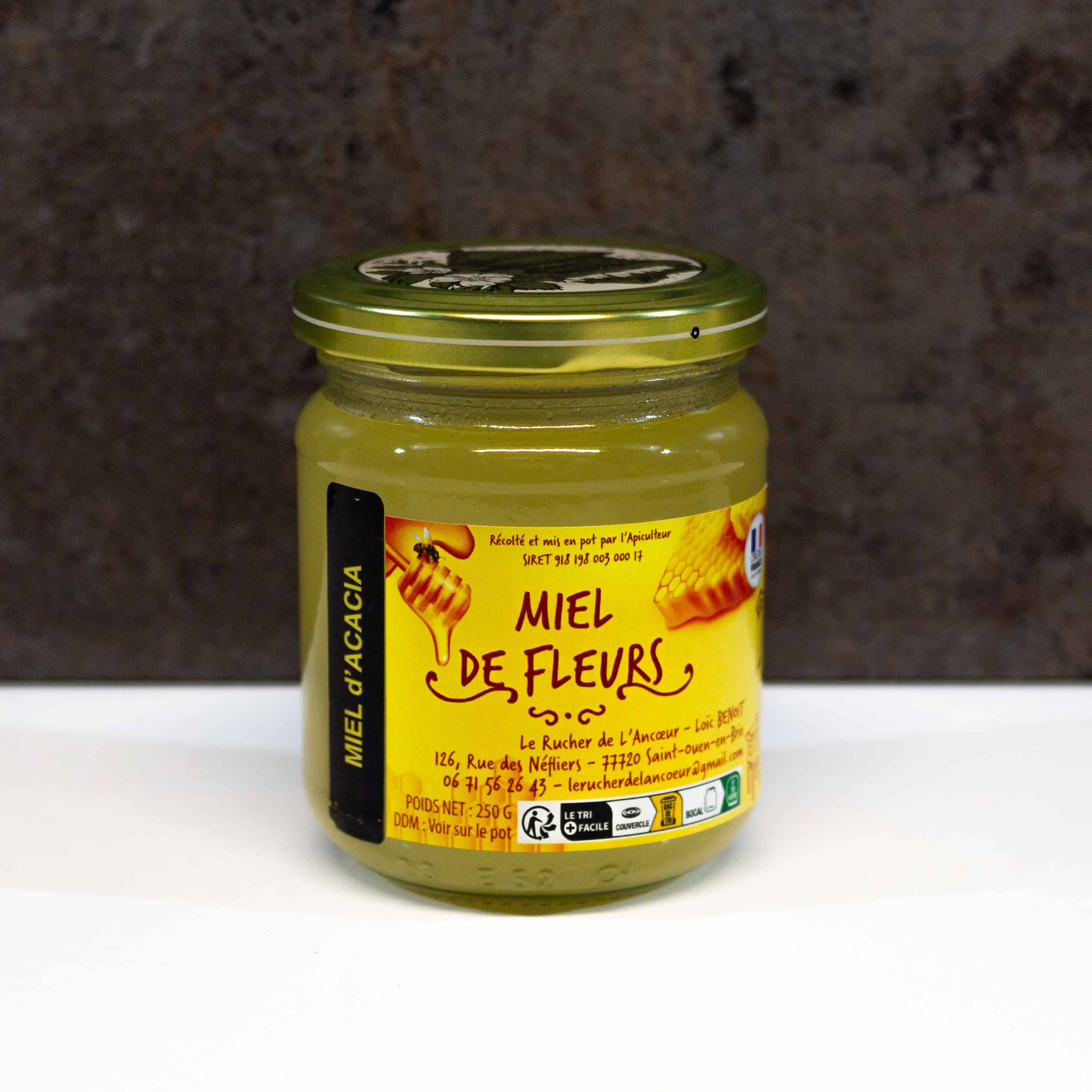 Miel de fleurs acacia 250g sur fond blanc
